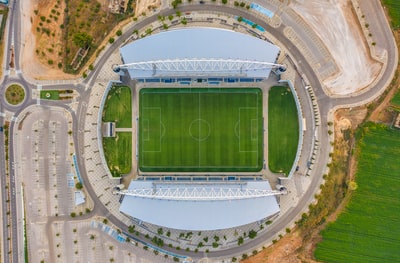 Green and white, stadium bird 's-eye view during the day
